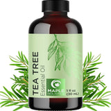 Dark amber glass bottle of Tea Tree Essential Oil in green label for pure essential oils