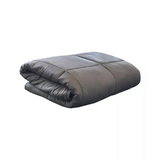 Dark gray plush weighted blanket with quilted sections for cozy comfort