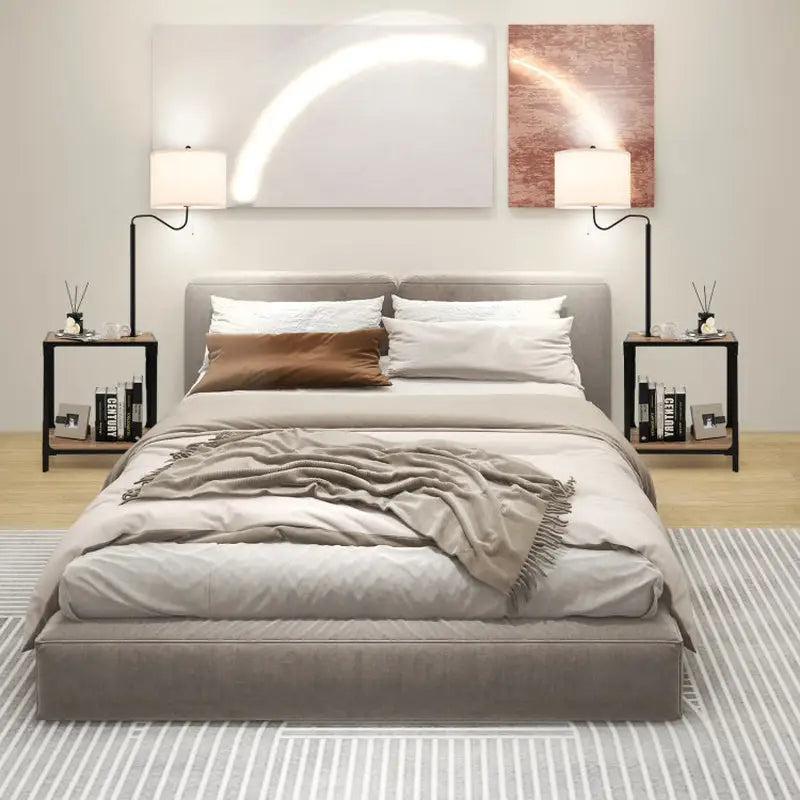 Modern upholstered bed with gray frame next to Adjustable Black Floor Lamp with USB charging ports