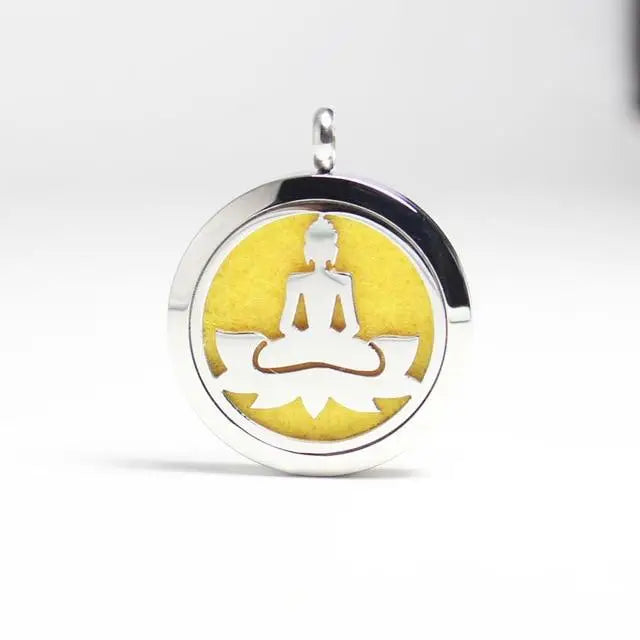 Silver Buddha pendant for essential oil diffusion on a vibrant yellow background