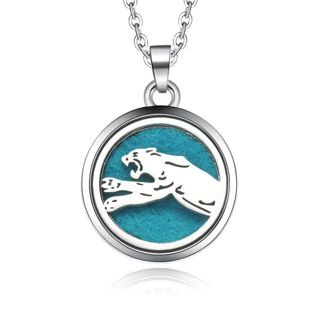 Silver necklace diffuser pendant with leaping jaguar silhouette on turquoise background