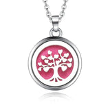 Silver necklace diffuser pendant with tree of hearts design on pink background