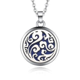 Circular silver necklace diffuser pendant with swirling blue and white pattern