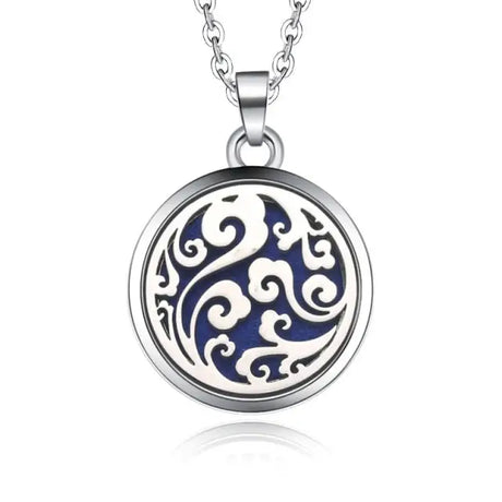 Circular silver necklace diffuser pendant with swirling blue and white pattern