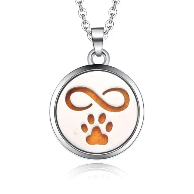 Silver necklace diffuser pendant with infinity symbol and paw print in copper tones