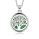 Silver necklace diffuser pendant with tree of life design and green background