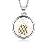 Silver necklace diffuser pendant featuring a pineapple design in a circular frame