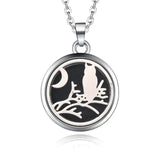 Silver necklace diffuser pendant with white cat silhouette, moon, and tree branch design