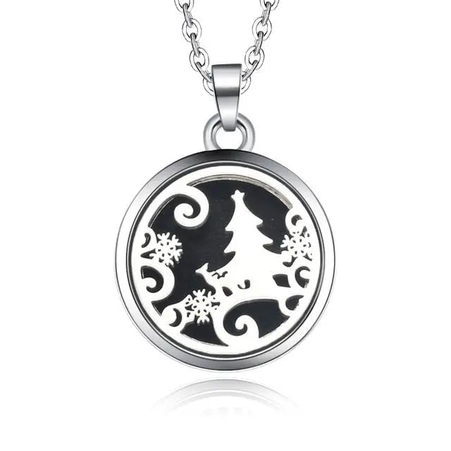 Silver necklace diffuser pendant featuring Christmas tree silhouette with snowflakes