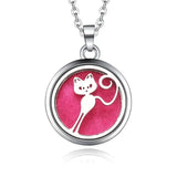 Silver necklace diffuser pendant with white cat silhouette on pink background