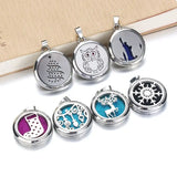 Collection of round silver essential oil necklace diffuser pendants with decorative designs