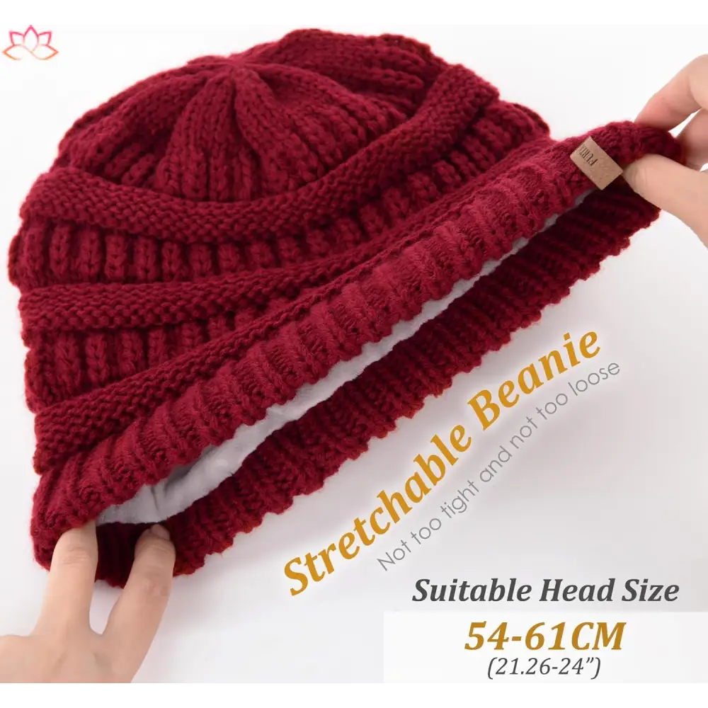 Deep red knitted beanie with ribbed texture, perfect for a slouchy winter hat look