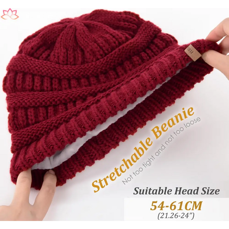 Deep red knitted beanie with ribbed texture, perfect for a slouchy winter hat look