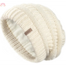 Cream-colored knit beanie with cable pattern for a stylish slouchy winter hat