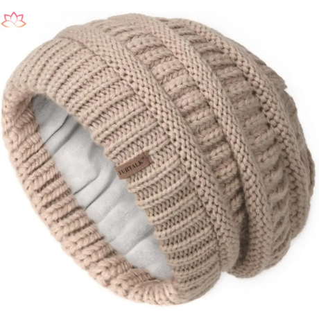 Beige knitted slouchy winter hat with ribbed pattern and fleece lining for warmth