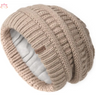 Beige knitted slouchy winter hat with ribbed pattern and fleece lining for warmth