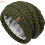 Olive green knit beanie with cable pattern and leather tag for slouchy winter hat style