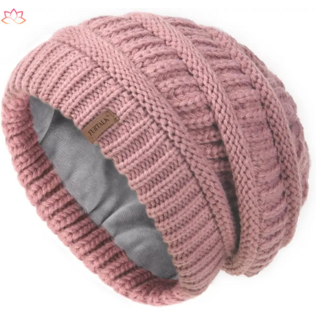 Pink slouchy winter hat knit beanie featuring a ribbed pattern and fleece lining