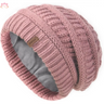 Pink slouchy winter hat knit beanie featuring a ribbed pattern and fleece lining