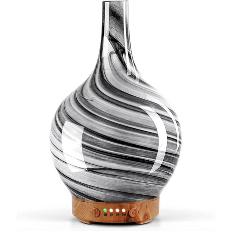 Glass diffuser with black and white swirls on wooden base for ultrasonic essential oil use