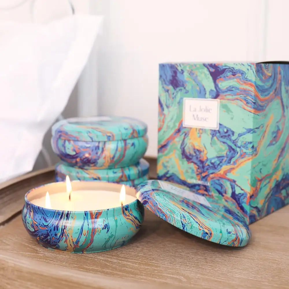 Decorative citronella-scented Pure Soy Wax candles in blue marble tin containers