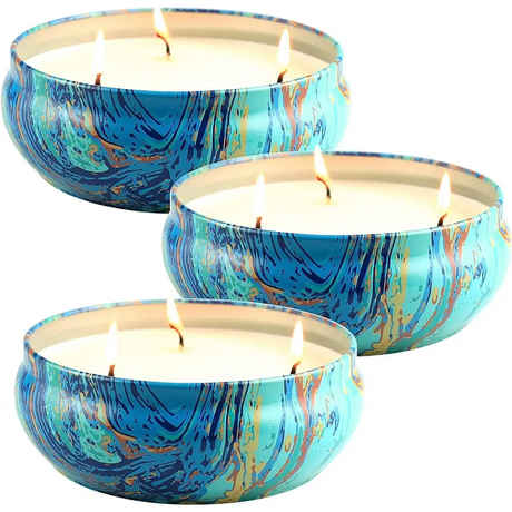 Three marbled blue and turquoise tin containers with pure soy wax multi-wick candles