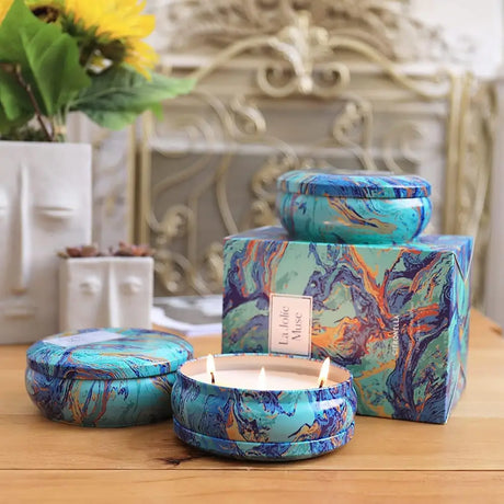 Turquoise tin candles with colorful marble patterns made of pure soy wax