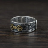 Ornate sterling silver Buddha Mantra ring with gold accents and decorative engravings