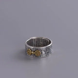 Ornate sterling silver Buddha Mantra ring with gold floral accents and filigree design