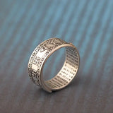 Silver ring with engraved Buddha mantra pattern, made of sterling silver