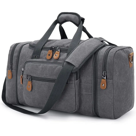 Grey canvas duffel bag with brown leather accents and 50L capacity multiple compartments