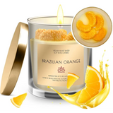 Lit Brazilian Orange scented soy candle in glass jar with gold lid for diffusers & candles