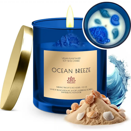 Blue Ocean Breeze Scented Soy Candle with gold lid, seashells, and sand decoration