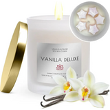 White scented soy candle with Vanilla Deluxe label, gold lid, and floral decorations