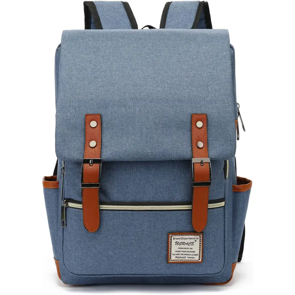 Blue canvas laptop backpack with brown leather shoulder straps and belt flap