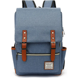 Blue canvas laptop backpack with brown leather shoulder straps and belt flap