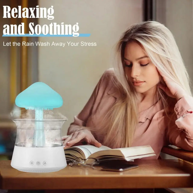 Glowing blue mushroom-shaped Cloud Rain Humidifier releasing soothing mist