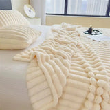 Cozy Faux Rabbit Fur Ribbed Blanket in Cream with textured wave patterns and plush feel