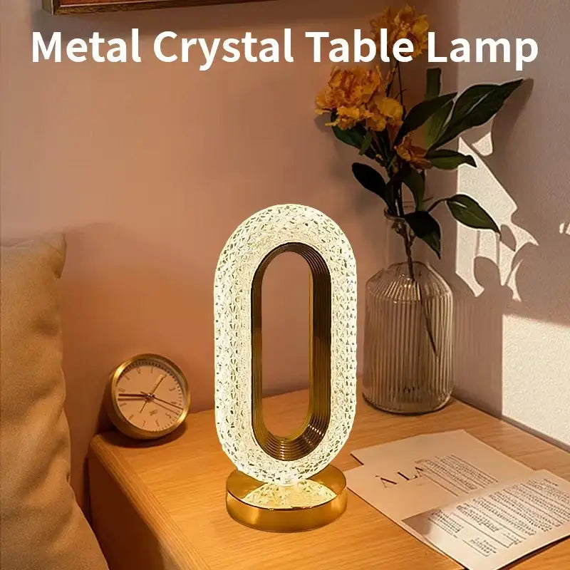 Cozy Nights Crystal Oval Table Lamp with Gold Base emitting warm white light