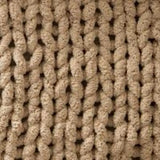 Beige knitted fabric with chunky cable stitch for Cozy Oat White Chunky Knit Blanket