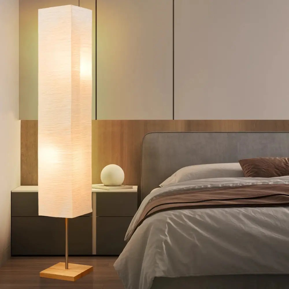 Dimmable LED Floor Lamp with Wooden Base and White Shade in stylish home setting