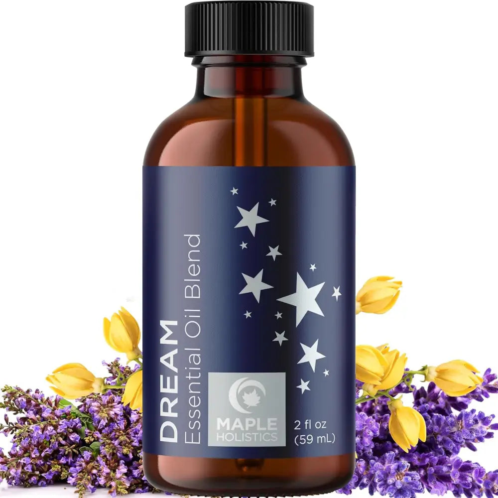 Amber glass bottle with navy blue label and silver stars for Dream and Breathe essential oil blend