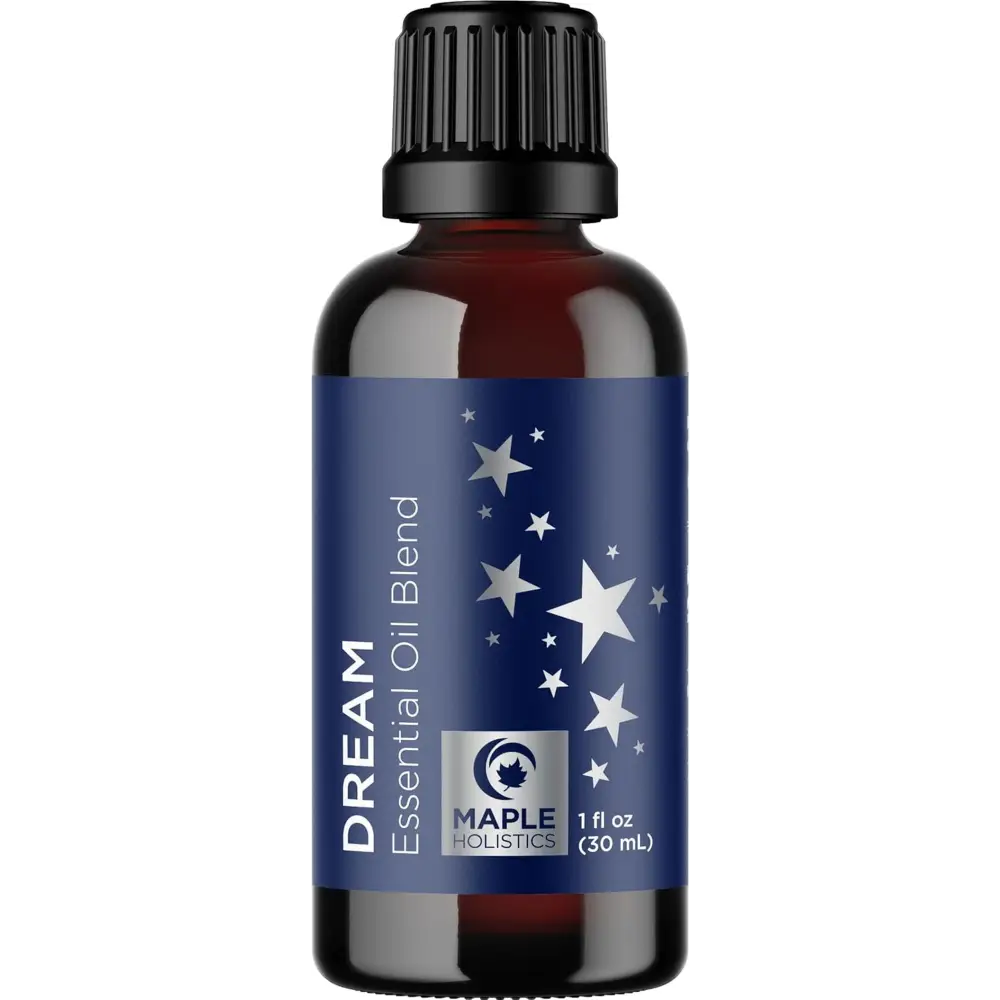 Dark amber glass bottle with a blue starry label for Dream and Breathe essential oil blend