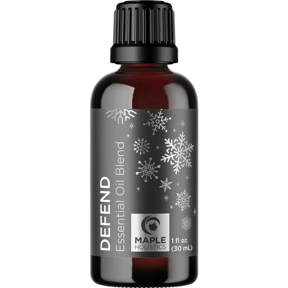 Dark amber essential oil bottle with snowflake design and Defend Essential Oil Blend label