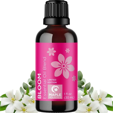 Dark amber glass bottle with pink flower label from Dream and Breathe Essential Oil Blend