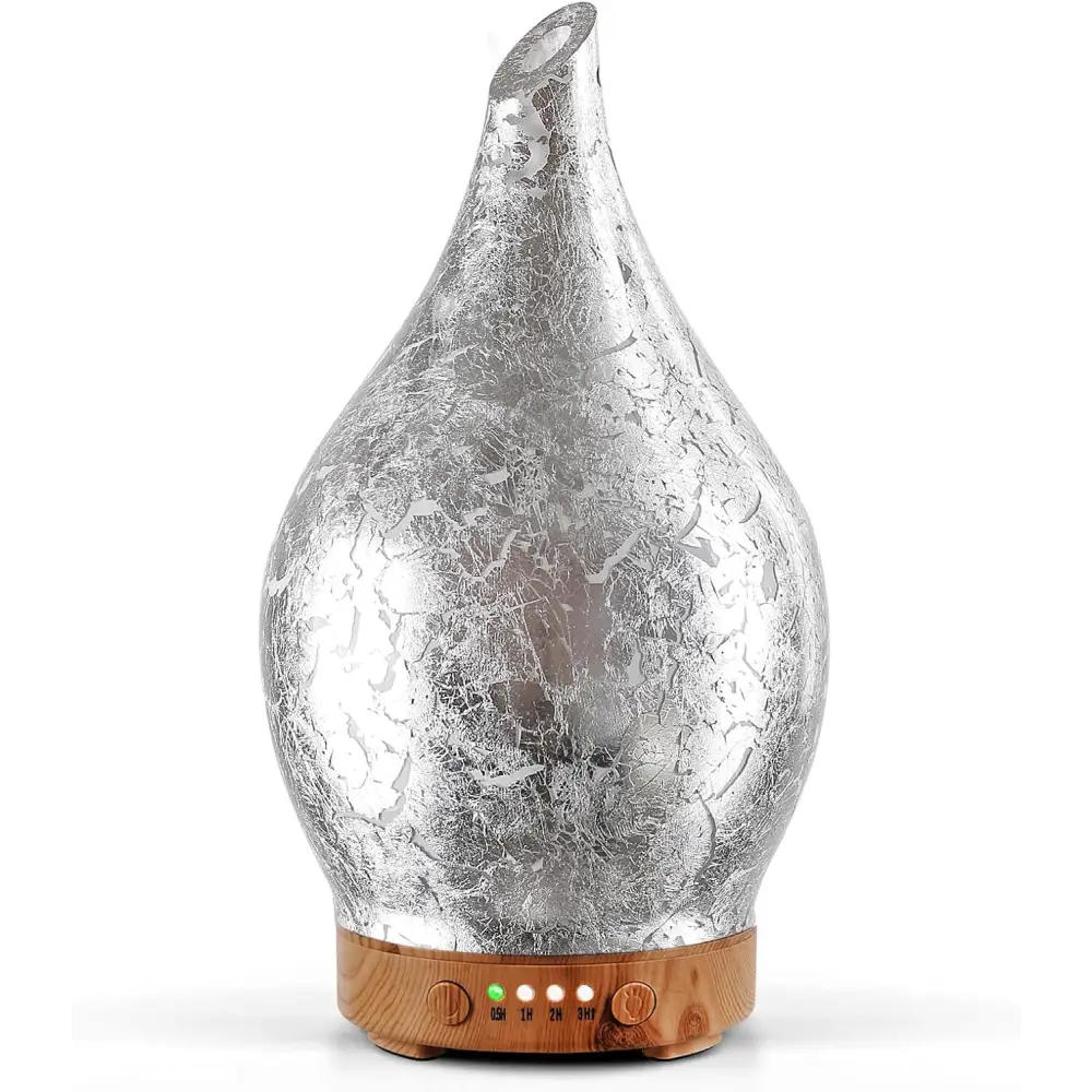 Silver metallic teardrop oil diffuser with wooden base and LED lights for glass aromatherapy