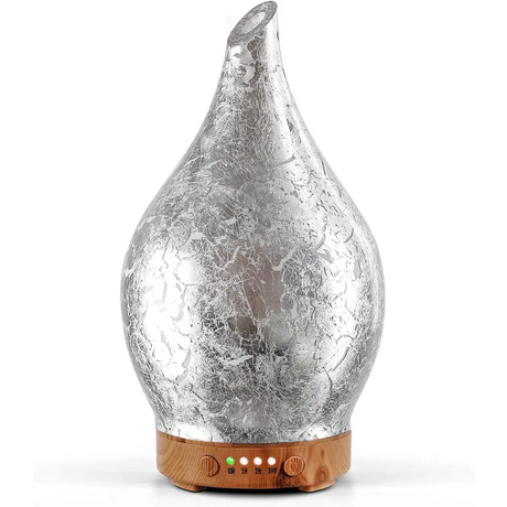 Silver metallic teardrop oil diffuser with wooden base and LED lights for glass aromatherapy