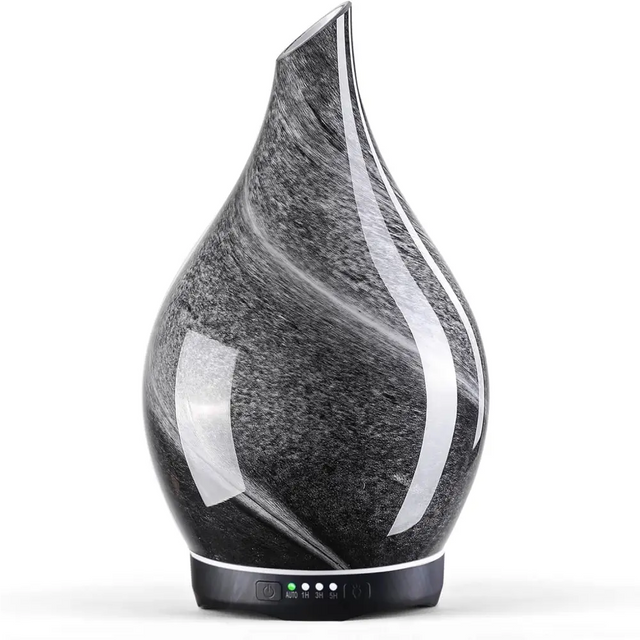 Teardrop-shaped black marble essential oil diffuser with white swirls for glass aromatherapy