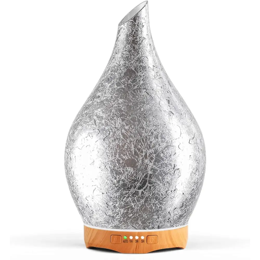 Silver teardrop oil diffuser with wooden base, part of Elegant 3D Glass Marble collection