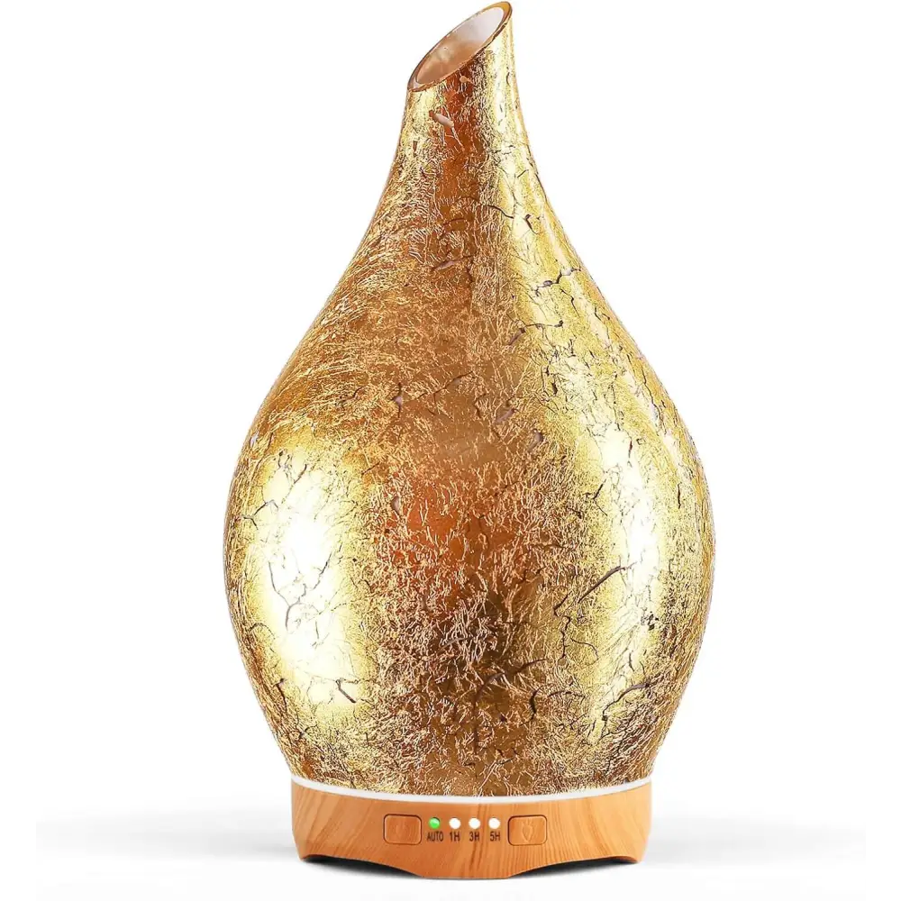 Gold teardrop-shaped oil diffuser with wooden base in Elegant 3D Glass Marble design